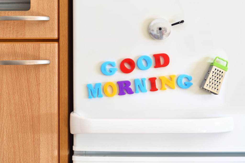 refrigerator door with good morning alphabet magnet